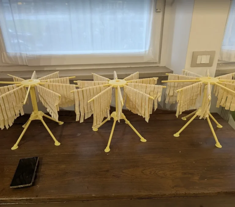 Pasta drying racks full of handmade tagliatelle
