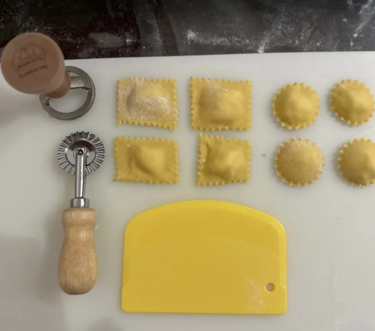 Square and round ravioli with a pasta cutter