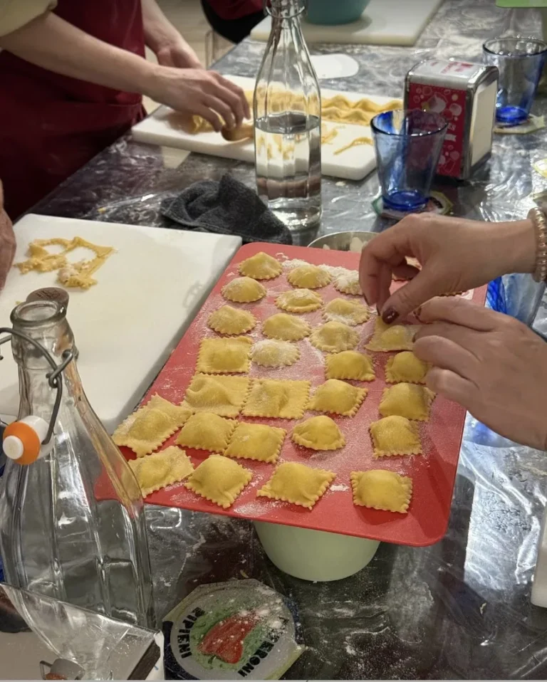 Guests filling a tray with homemade ravioli