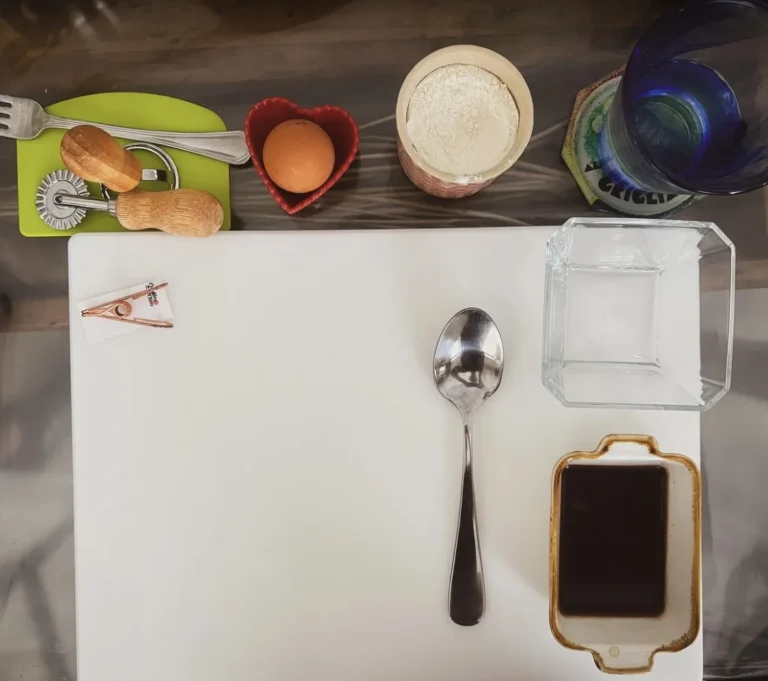 A guest station seen from above: flour, egg, coffee and tools