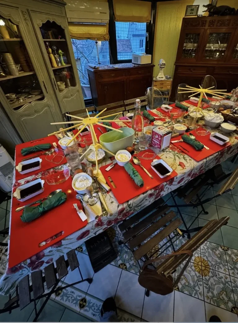 The class table set with red tablecloths