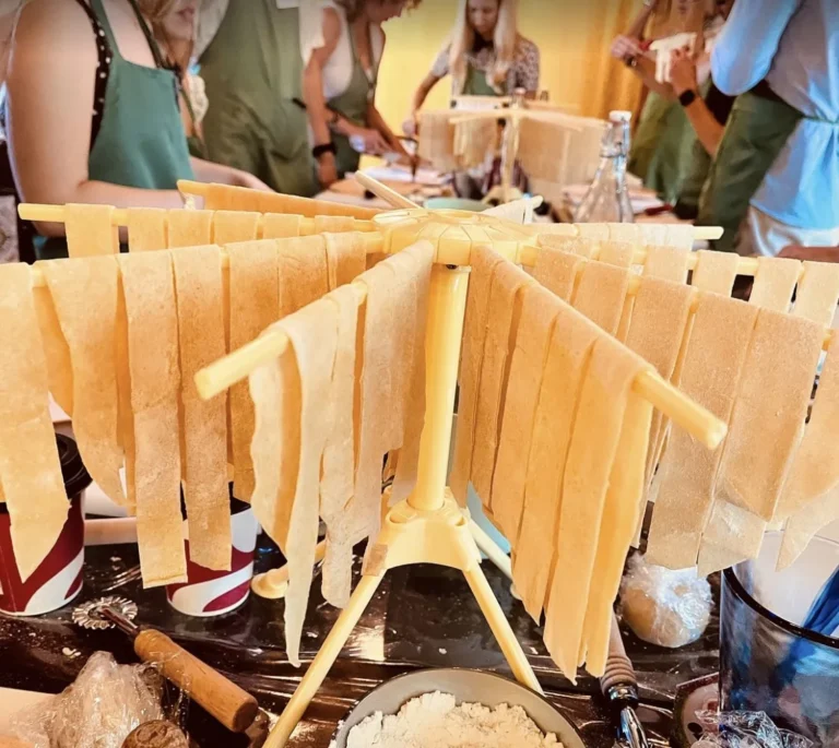 Golden light on fresh tagliatelle on the drying rack