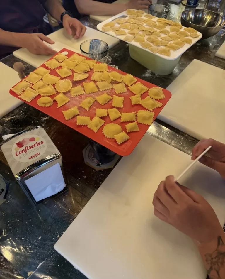 Fresh ravioli on a red board
