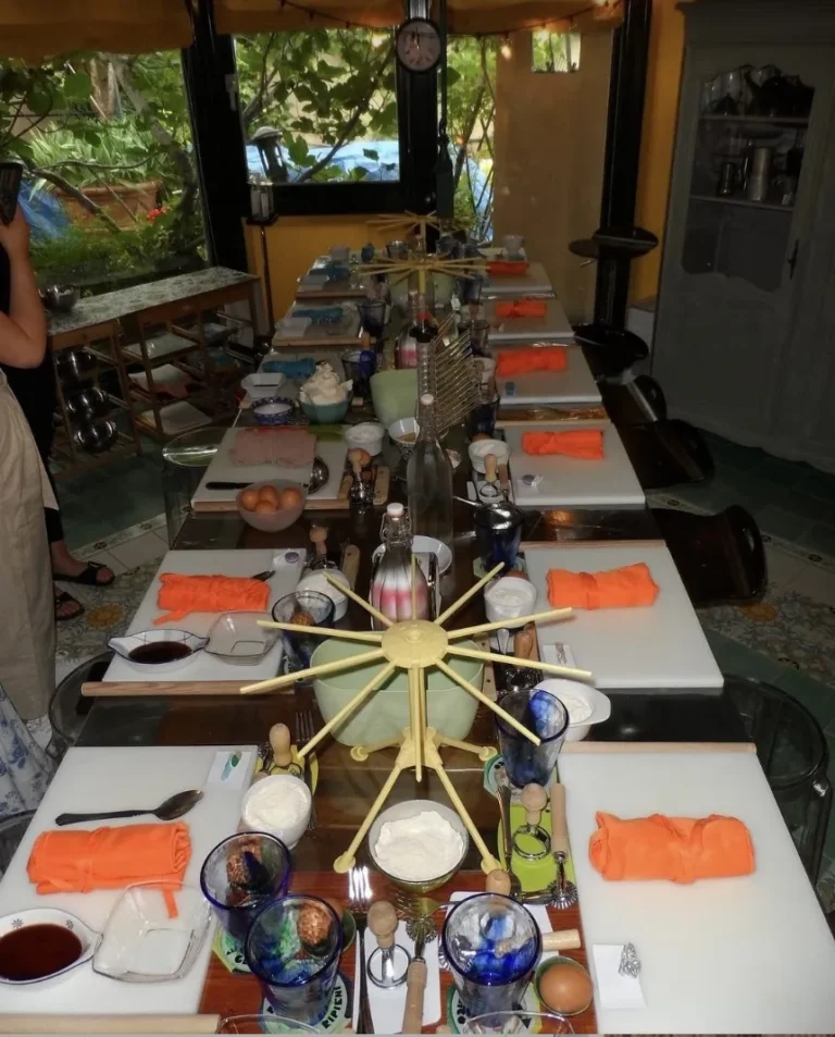 The long class table set with orange aprons