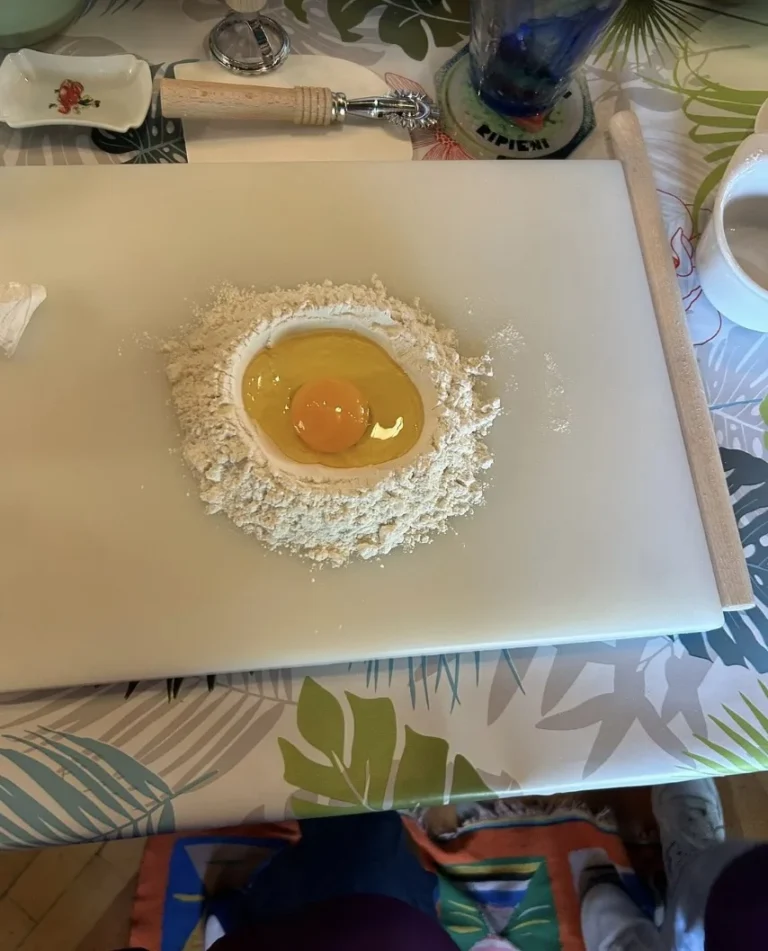 Egg in a flour well on a tropical tablecloth